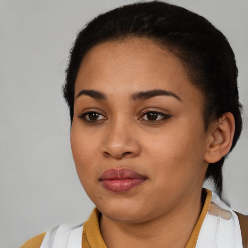 Joyful latino young-adult female with short  brown hair and brown eyes