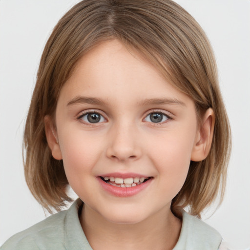 Joyful white child female with medium  brown hair and grey eyes