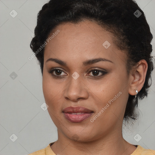 Joyful black young-adult female with short  brown hair and brown eyes