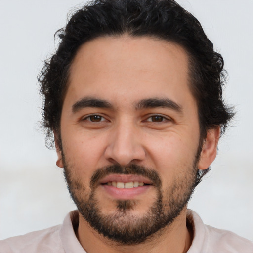 Joyful white young-adult male with short  black hair and brown eyes