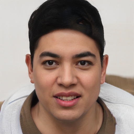 Joyful latino young-adult male with short  brown hair and brown eyes