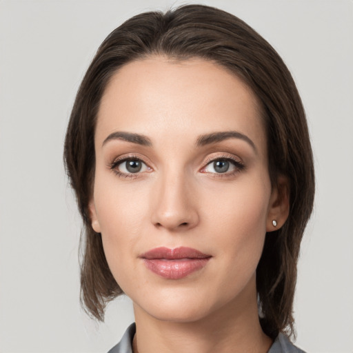 Neutral white young-adult female with medium  brown hair and grey eyes