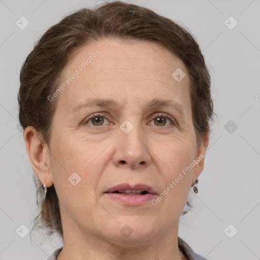 Joyful white adult female with short  brown hair and grey eyes