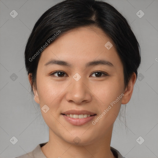 Joyful asian young-adult female with short  brown hair and brown eyes