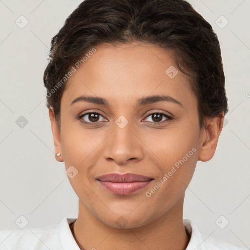 Joyful latino young-adult female with short  brown hair and brown eyes