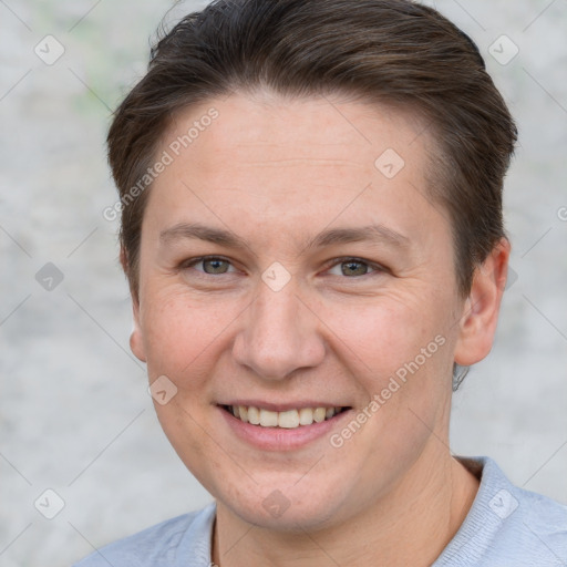 Joyful white adult female with short  brown hair and brown eyes