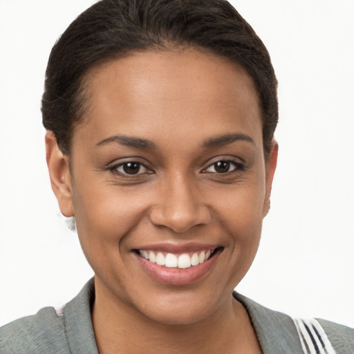 Joyful black young-adult female with short  brown hair and brown eyes