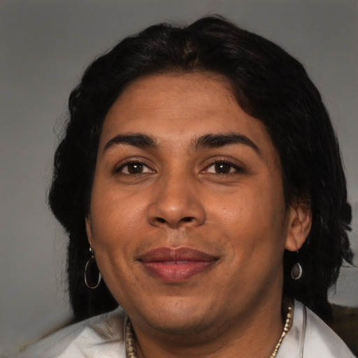 Joyful latino adult female with short  black hair and brown eyes