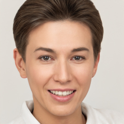 Joyful white young-adult female with short  brown hair and brown eyes