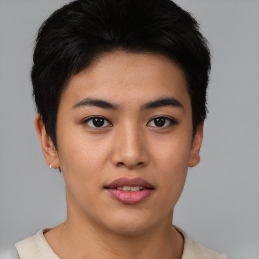 Joyful asian young-adult female with short  brown hair and brown eyes