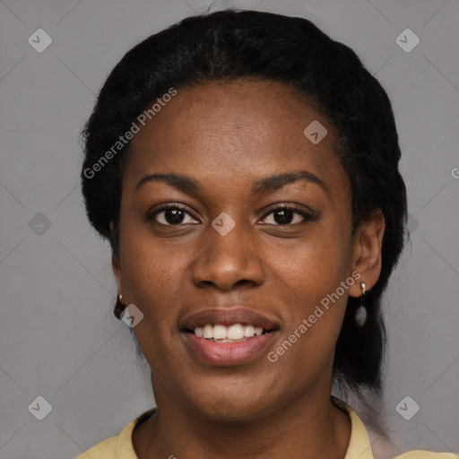 Joyful black young-adult female with short  black hair and brown eyes