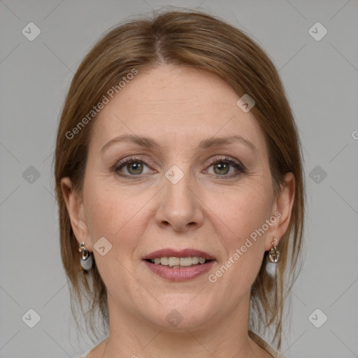 Joyful white adult female with medium  brown hair and grey eyes