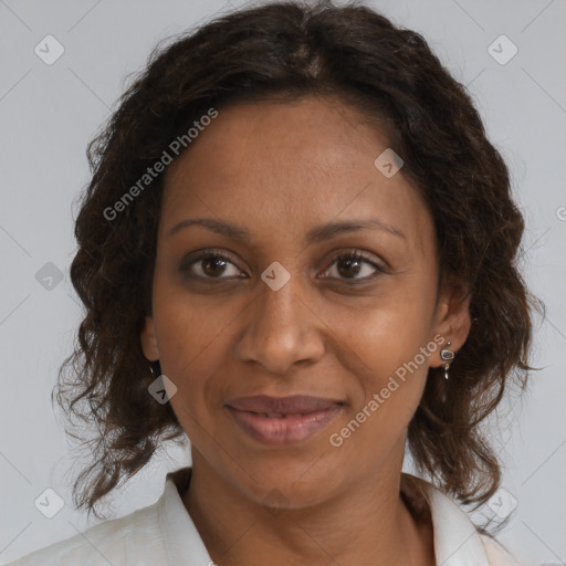 Joyful black adult female with medium  brown hair and brown eyes