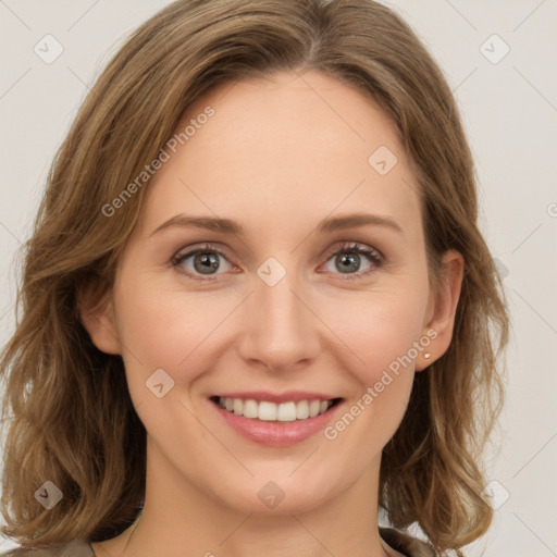 Joyful white young-adult female with long  brown hair and green eyes