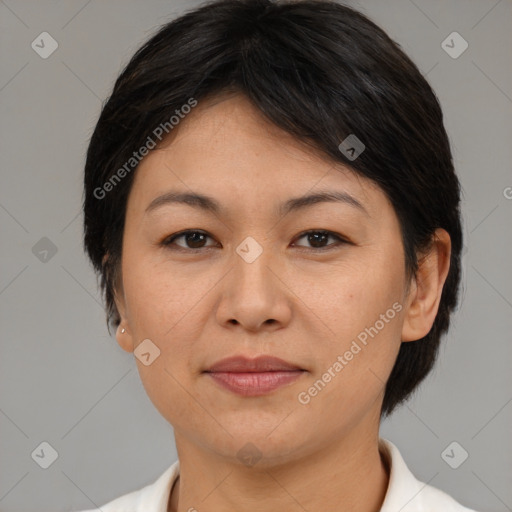 Joyful asian adult female with medium  brown hair and brown eyes