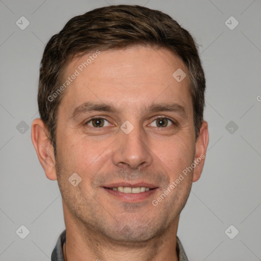 Joyful white adult male with short  brown hair and brown eyes