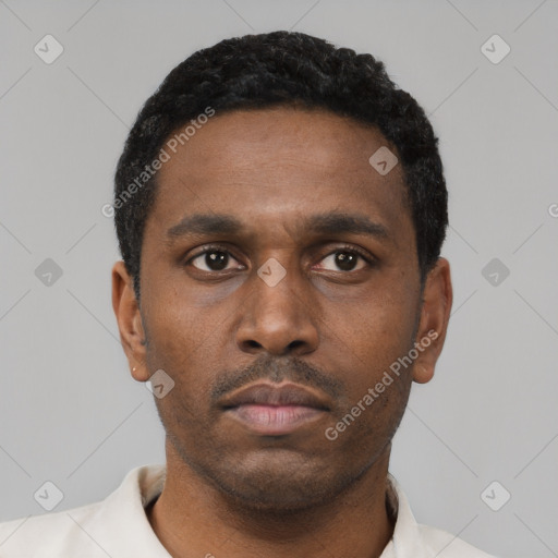 Neutral latino young-adult male with short  black hair and brown eyes