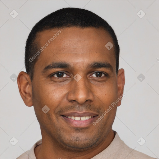 Joyful black young-adult male with short  black hair and brown eyes