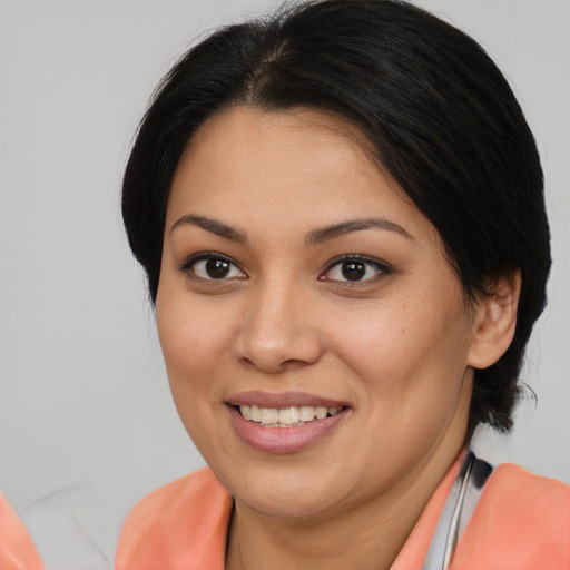 Joyful asian young-adult female with medium  brown hair and brown eyes