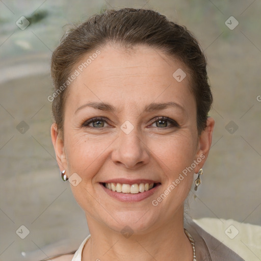 Joyful white adult female with short  brown hair and brown eyes