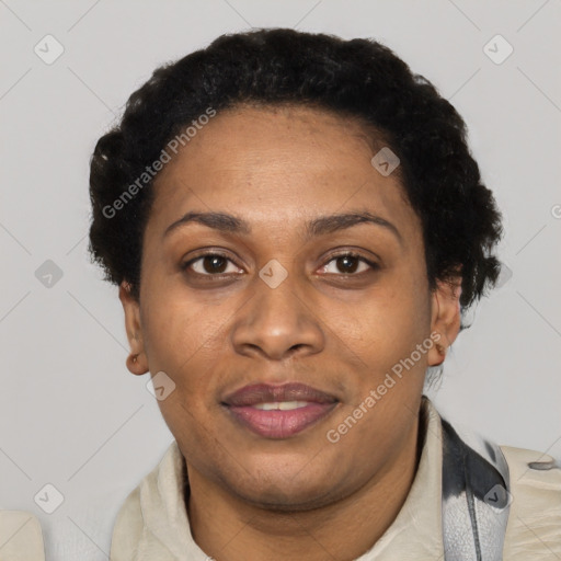 Joyful black adult female with short  black hair and brown eyes