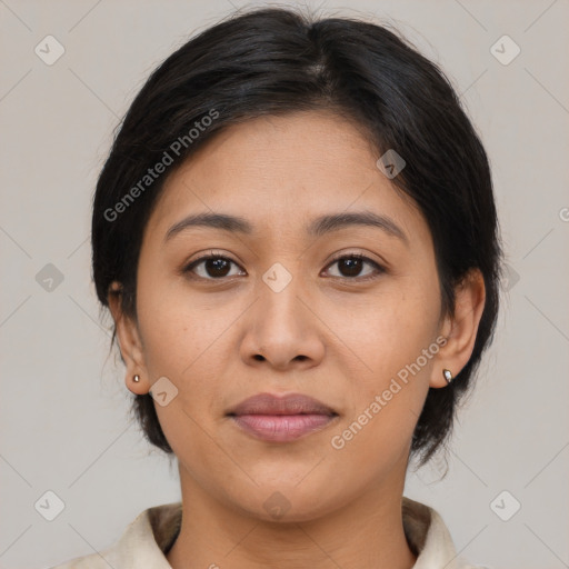 Joyful latino young-adult female with medium  brown hair and brown eyes