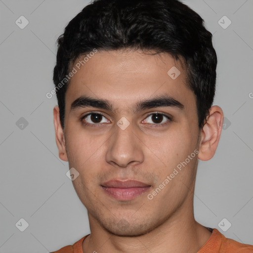 Joyful white young-adult male with short  black hair and brown eyes