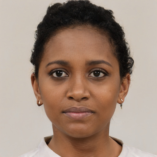 Neutral black young-adult female with short  brown hair and brown eyes