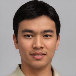 Joyful asian young-adult male with short  black hair and brown eyes