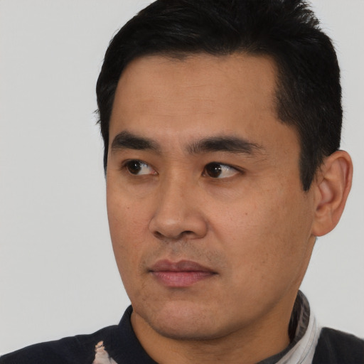 Neutral asian young-adult male with short  black hair and brown eyes