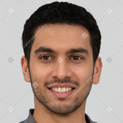 Joyful latino young-adult male with short  black hair and brown eyes