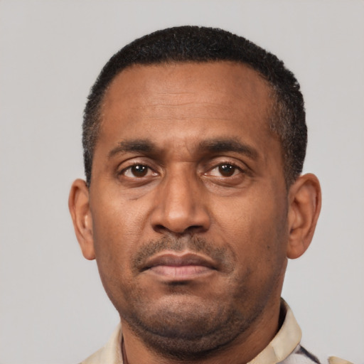Neutral latino adult male with short  black hair and brown eyes