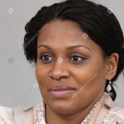 Joyful black adult female with medium  brown hair and brown eyes