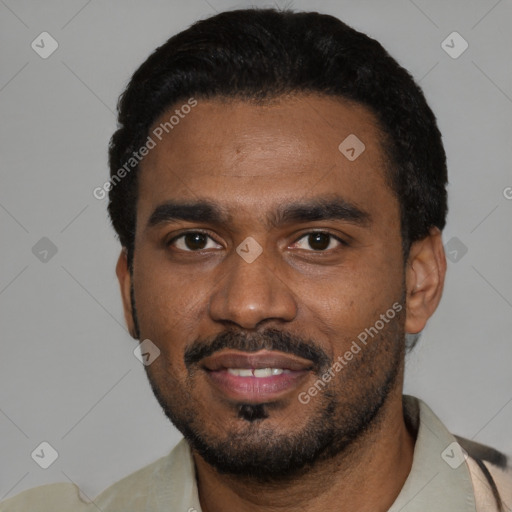 Joyful black young-adult male with short  black hair and brown eyes