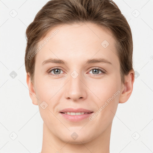 Joyful white young-adult female with short  brown hair and grey eyes