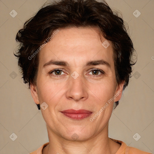 Joyful white adult female with short  brown hair and brown eyes