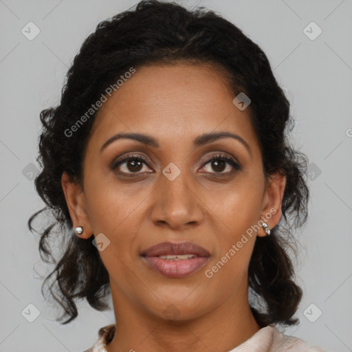 Joyful black adult female with medium  brown hair and brown eyes