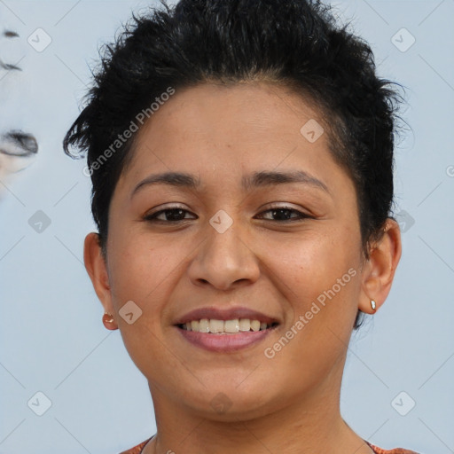 Joyful latino young-adult female with short  brown hair and brown eyes