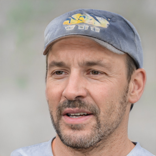 Joyful white adult male with short  black hair and brown eyes