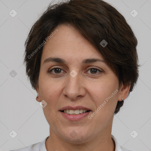 Joyful white adult female with short  brown hair and brown eyes