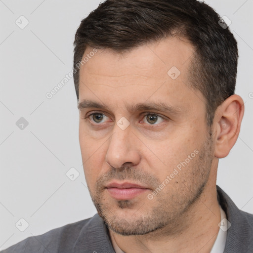 Neutral white adult male with short  black hair and brown eyes