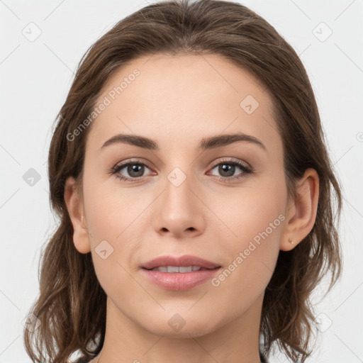 Joyful white young-adult female with medium  brown hair and grey eyes