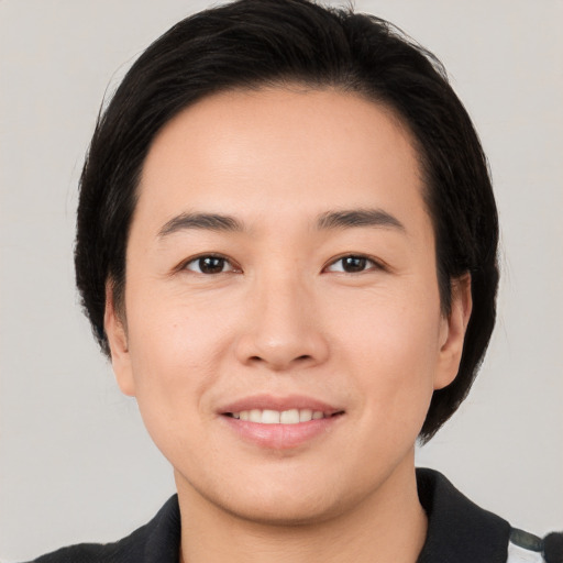 Joyful white young-adult male with medium  brown hair and brown eyes