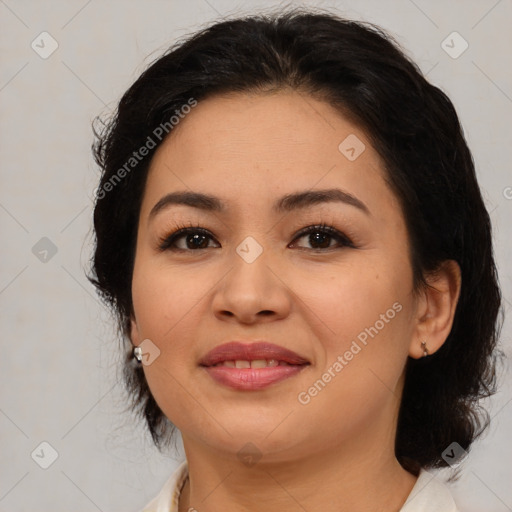 Joyful latino young-adult female with medium  brown hair and brown eyes