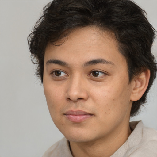 Joyful white young-adult male with medium  brown hair and brown eyes