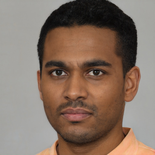 Neutral latino young-adult male with short  black hair and brown eyes