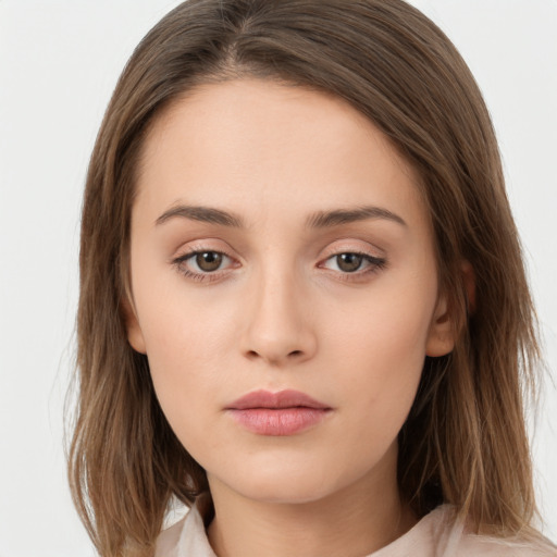 Neutral white young-adult female with long  brown hair and brown eyes