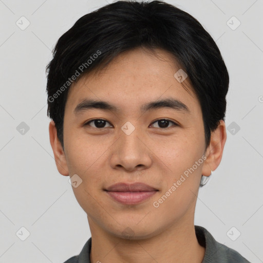 Joyful asian young-adult male with short  black hair and brown eyes