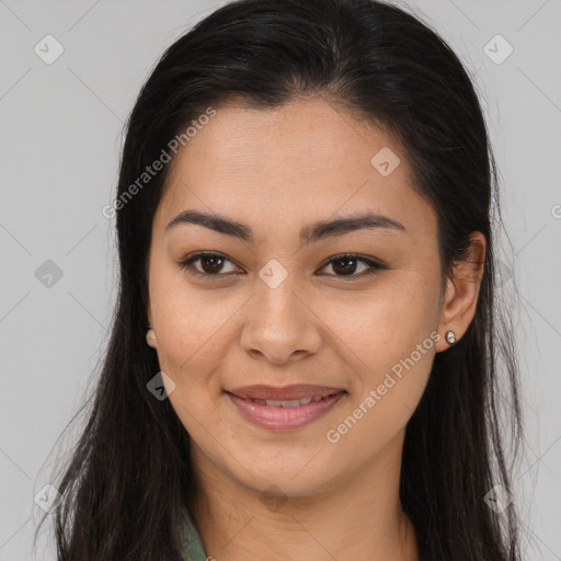 Joyful latino young-adult female with long  brown hair and brown eyes