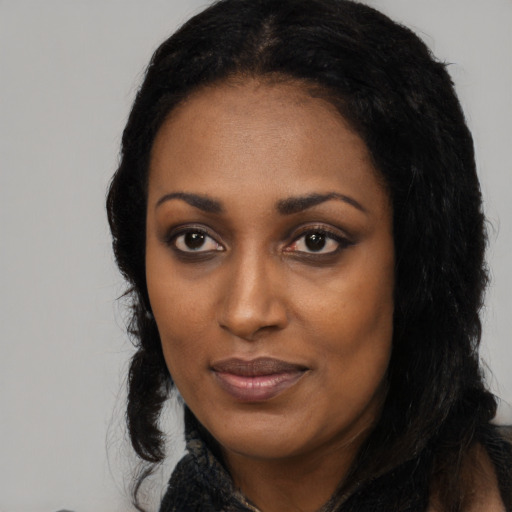 Neutral black young-adult female with long  black hair and brown eyes